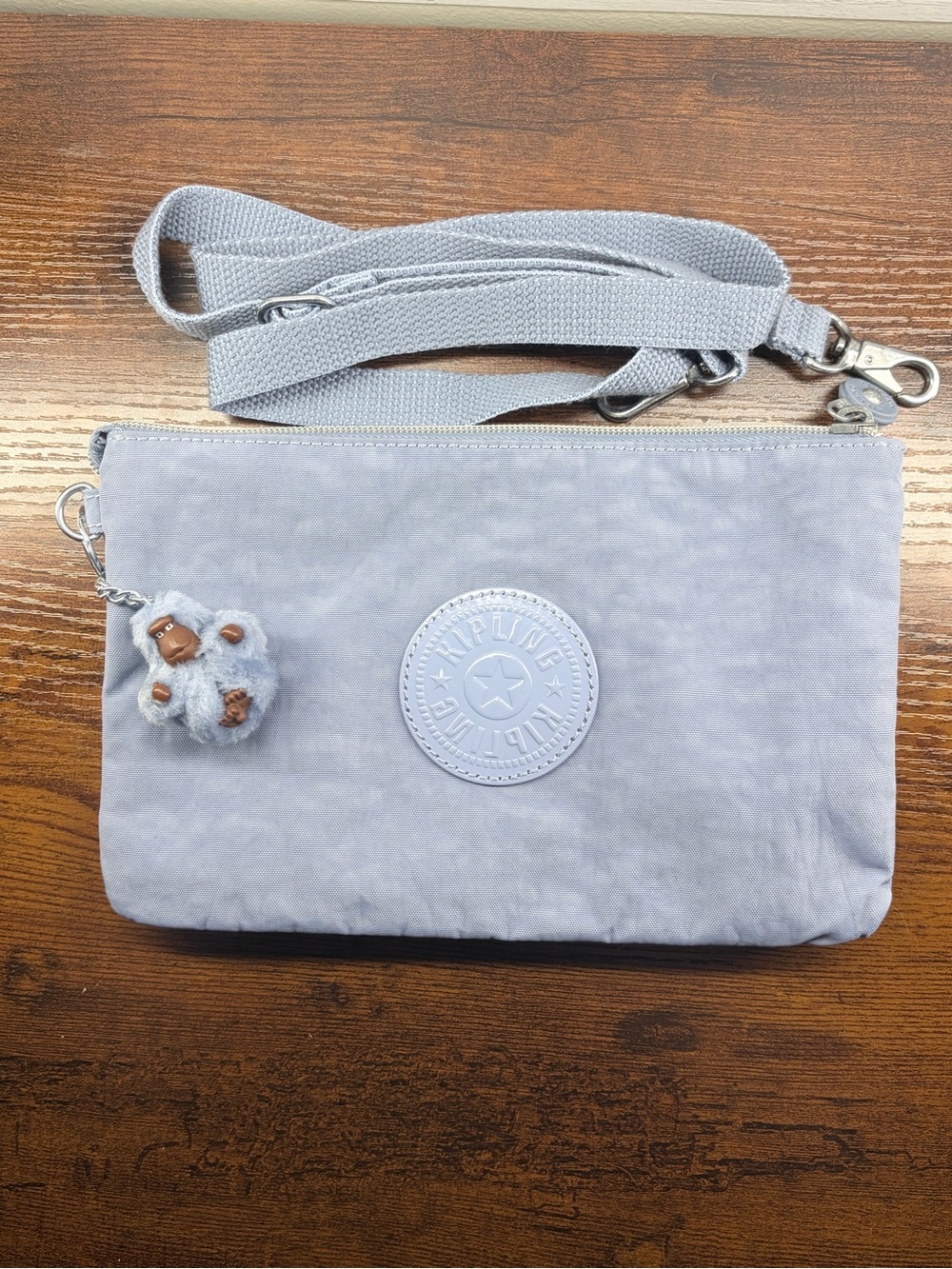 NWT Kipling Riri Light Blue Small Crossbody Pouch with Monkey Charm